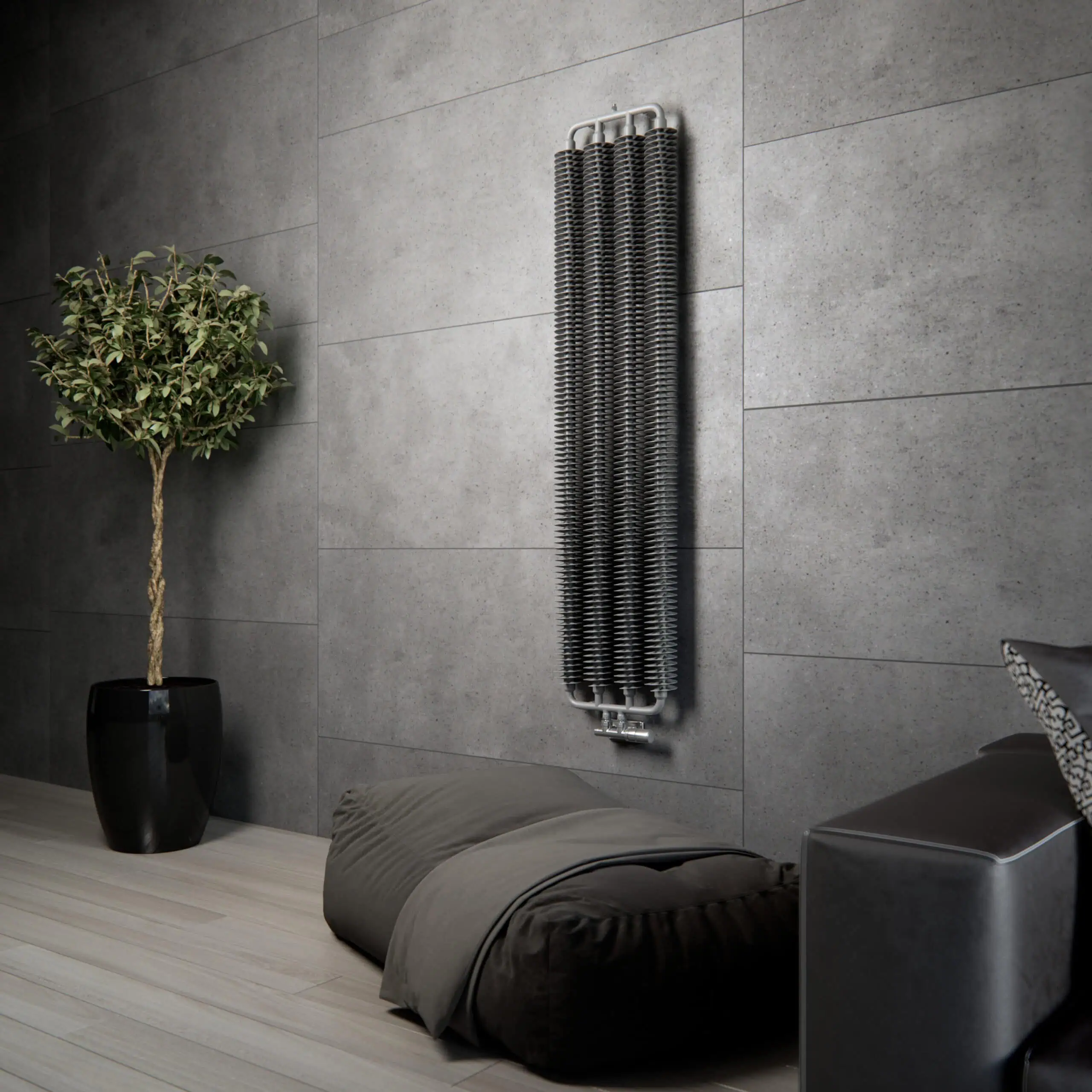 Radiator heater on modern grey wall with plant and cushion in contemporary interior decor.