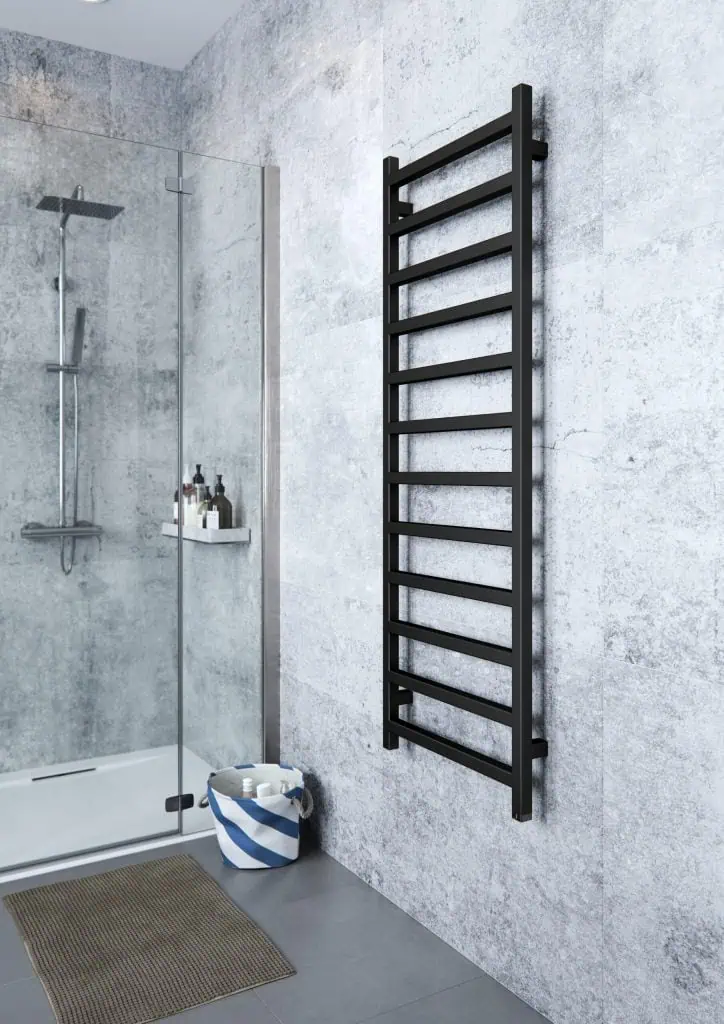Modern black towel radiator in minimalist bathroom with walk-in shower and textured wall tiles.
