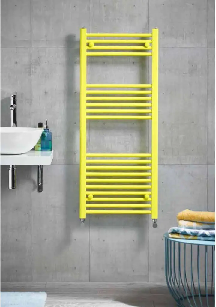 Bright yellow towel radiator for bathroom heating and drying essentials.