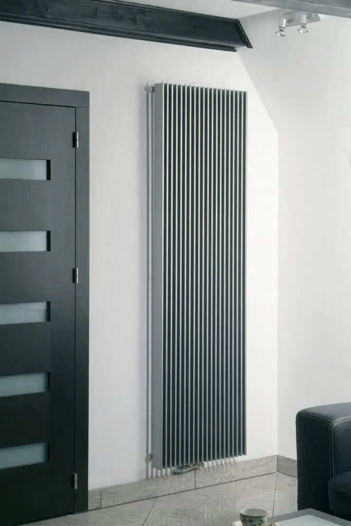 Modern vertical radiator in a stylish interior, perfect for heating and decor.