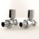 Shiny chrome radiator valves for plumbing and heating systems.