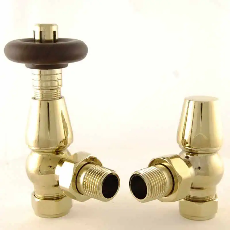 BEN-B_800-1.jpg Shiny brass angle valves with black handles, plumbing fittings for heating and water systems.