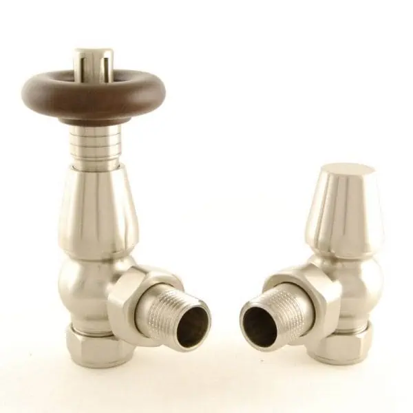 Brass radiator valves with traditional design for heating system control.