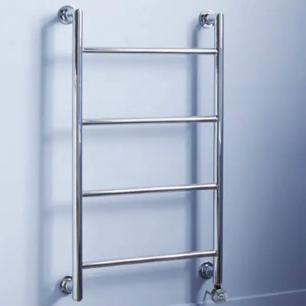 Polished stainless steel towel radiator on light blue wall.