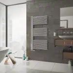 Modern heated towel radiator in a contemporary bathroom setting.
