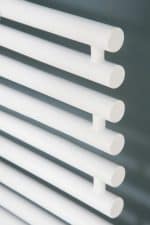 Smooth white radiator heating panel for home or office heating solutions.