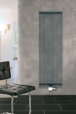 Stylish vertical designer radiator in modern interior setting for heating and decor.