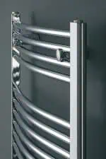 Polished stainless steel radiator, modern heating towel rail, sleek bathroom heater.