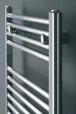 Shiny silver towel radiator, modern heated towel rail for bathroom decor.
