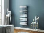 Modern white towel radiator in a stylish bathroom.