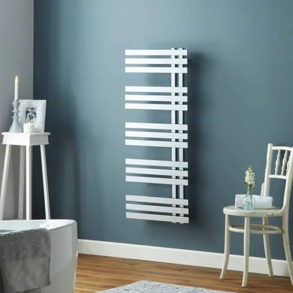 Modern white towel radiator in a stylish bathroom.