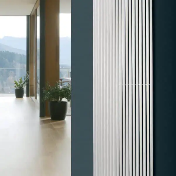 Modern white vertical radiator for home heating, stylish and efficient.