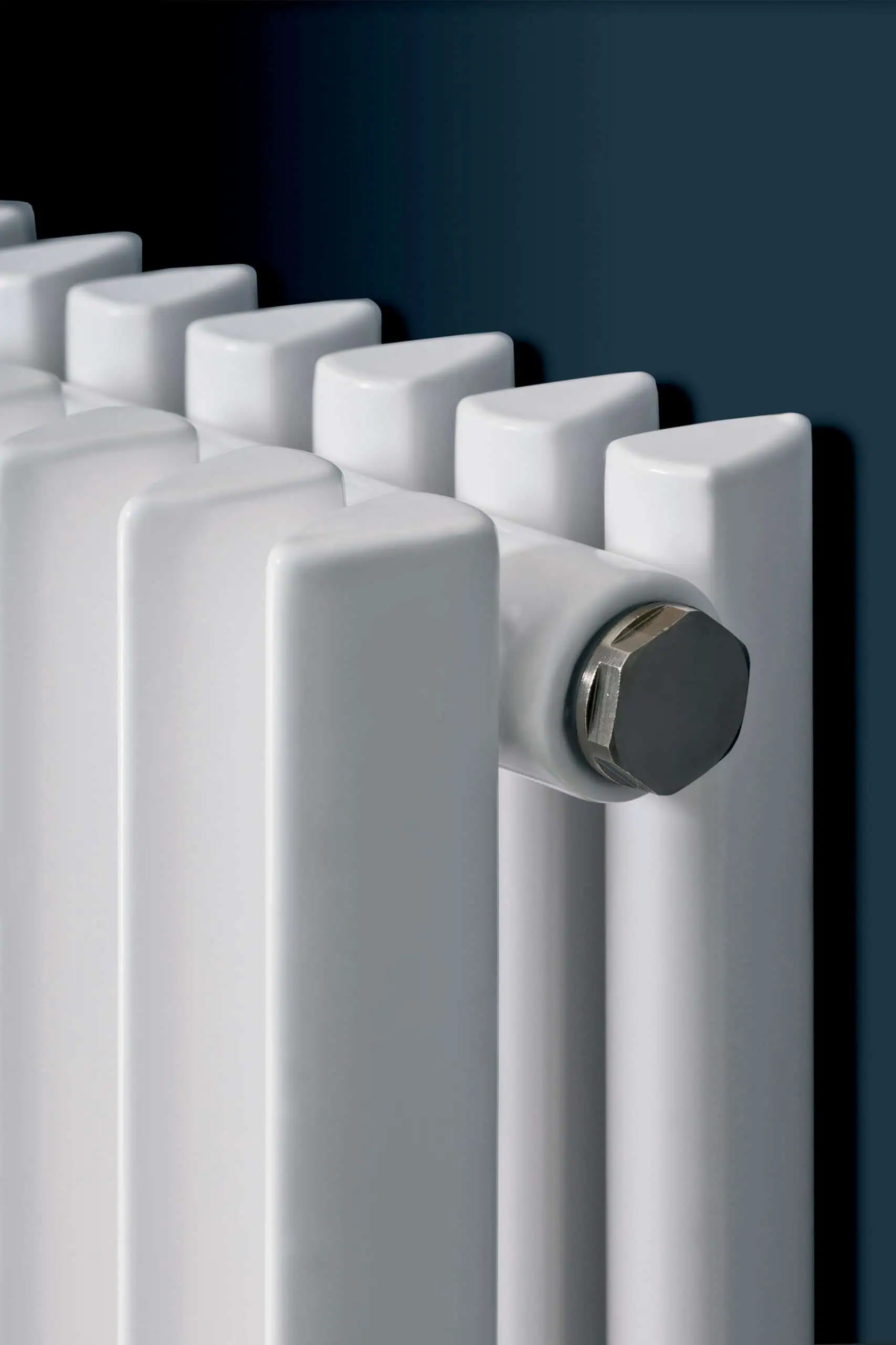 Corus-Duo-Detail-scaled-2.jpg Radiator heating system for modern home or office, energy-efficient radiator with white finish.