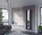 Contemporary radiator design in modern living room with brick accent wall and minimalist decor.
