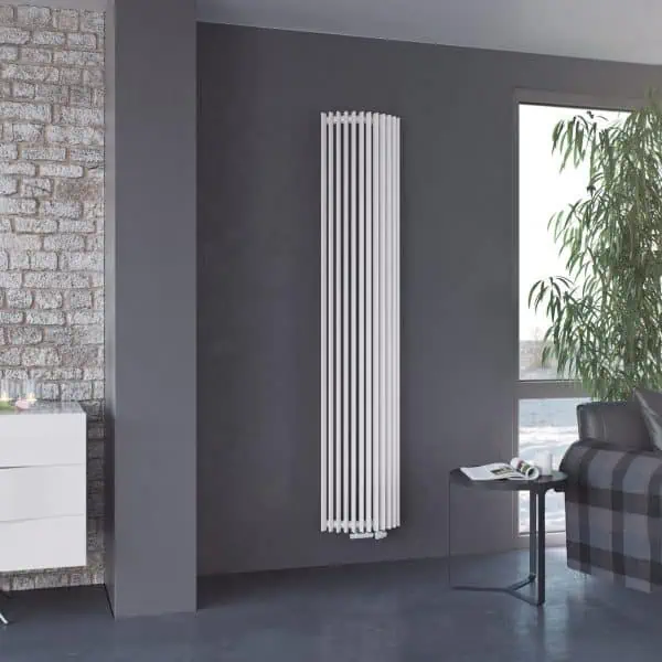 Modern vertical white radiator in contemporary living room, stylish heating solution.