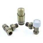 Bronze radiator valve fittings with white cap for heating systems.