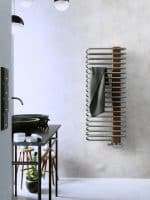 Modern bathroom towel radiator with wooden panel, wall-mounted. Stylish and functional heat source for contemporary home decor.