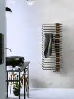 Modern bathroom towel radiator with wooden panel, wall-mounted. Stylish and functional heat source for contemporary home decor.