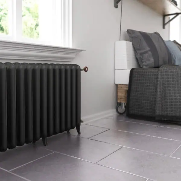 Black cast iron radiator in modern living room decor.