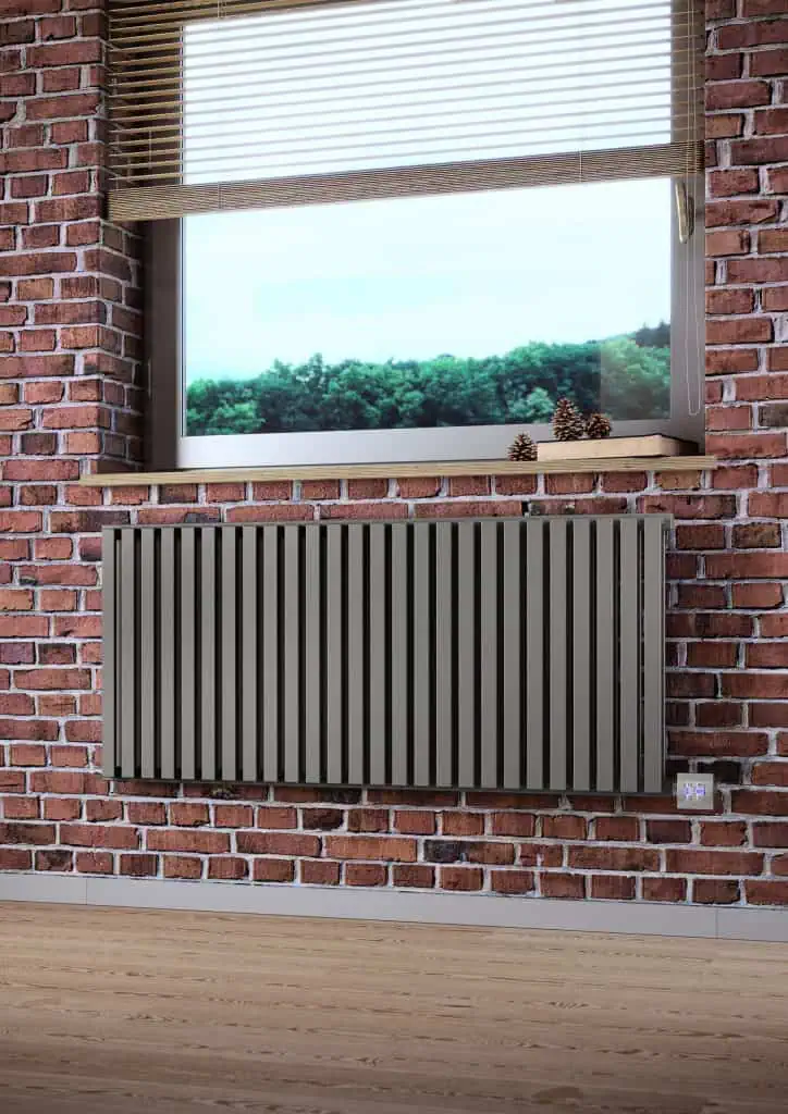 Modern radiator with sleek design installed in a stylish brick wall interior.