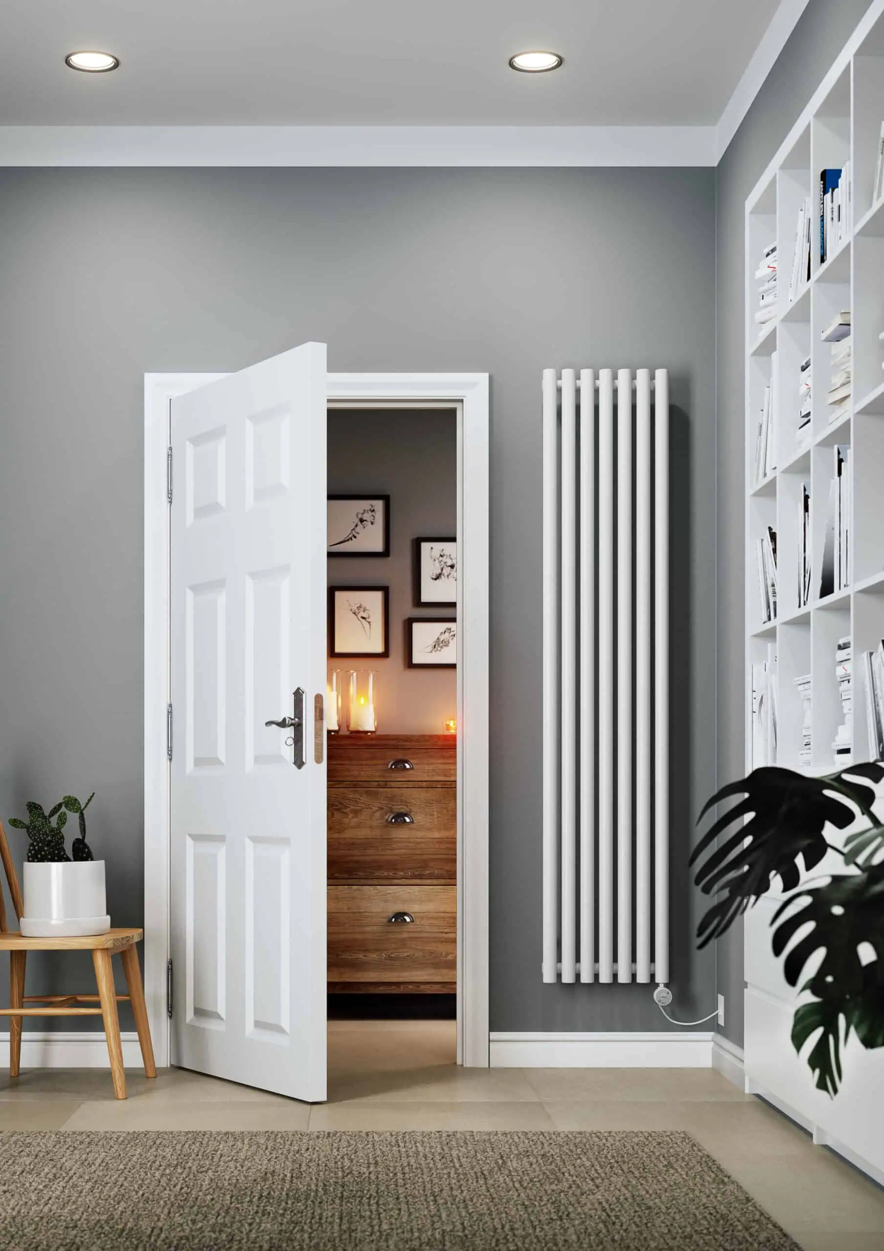 EAN-5901804743146-WLROR180048-S916ESMOBP01-Electric-Radiator-Rolo-Room-E-1800x480-White-Lifestyle-3-scaled-2.jpg Modern gray living room with white door, radiator, and bookshelf, stylish interior decor.