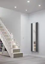 Modern home interior with stylish radiator and staircase, contemporary design, clean white walls, and minimalistic decor.