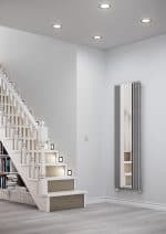 Modern radiator with a mirror in a minimalist interior setting, stylish home heating solution.