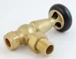 Brass pneumatic component with black rubber wheel for industrial applications.