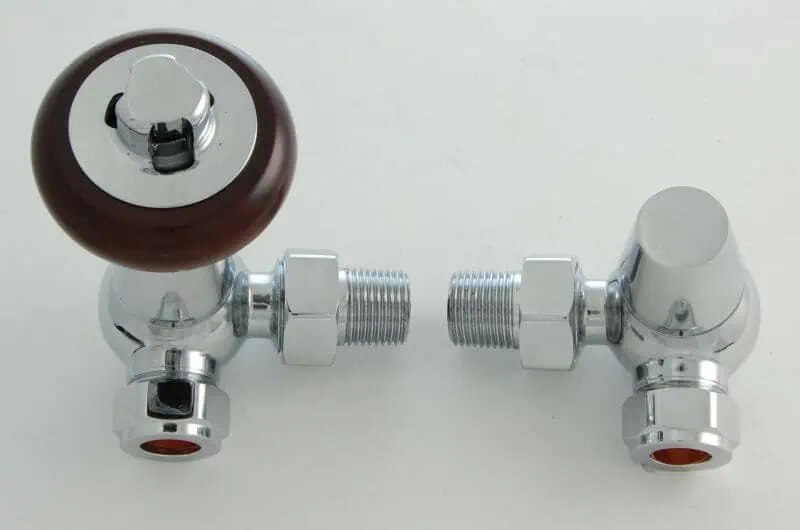 FAR-CR-C-ALT_800-1.jpg 1. Brass radiator valve with wooden handle and chrome finish for heating control.