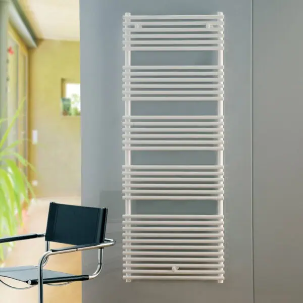 Modern white heated towel radiator for bathroom heating and drying towels. Stylish design, perfect for contemporary interiors.