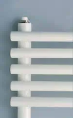 Radiator valve and white heating radiator for home heating system.