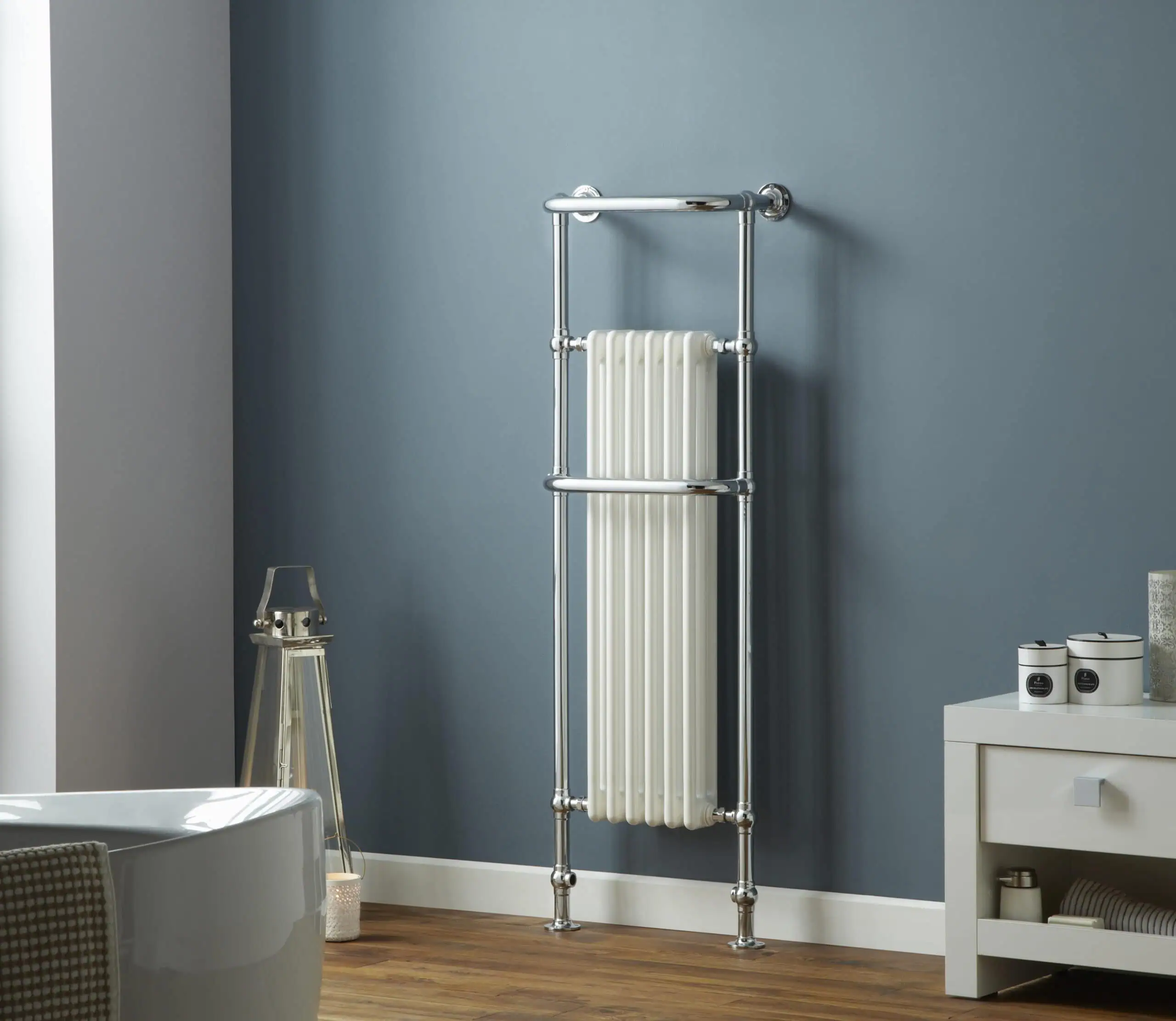 Hampshire-scaled-2.jpg Shower radiator with chrome finish in modern bathroom setting.