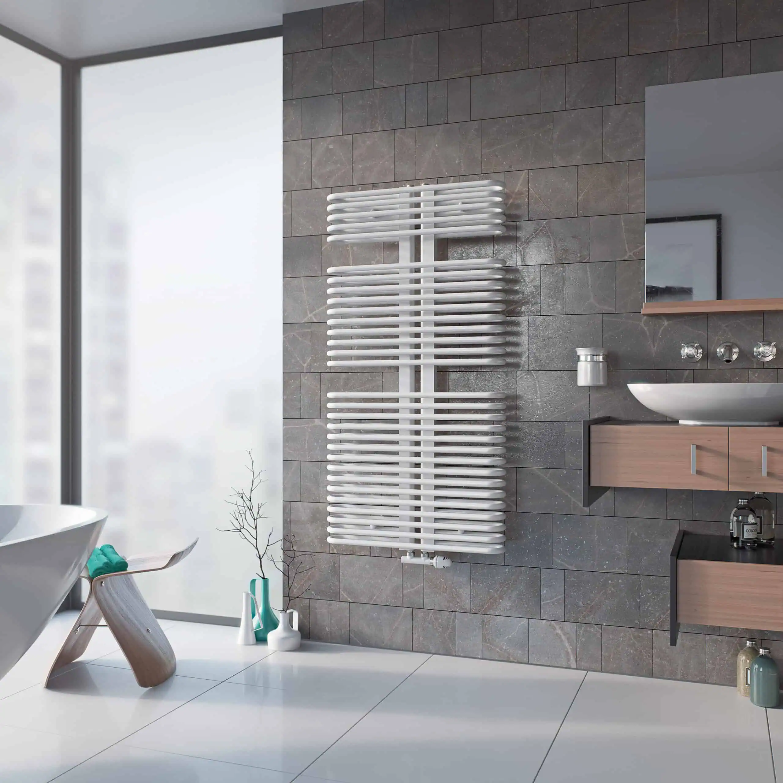 Helios-Hero-scaled-2.jpg Modern white heated towel rail in a stylish bathroom with grey tiled wall and wooden cabinetry.