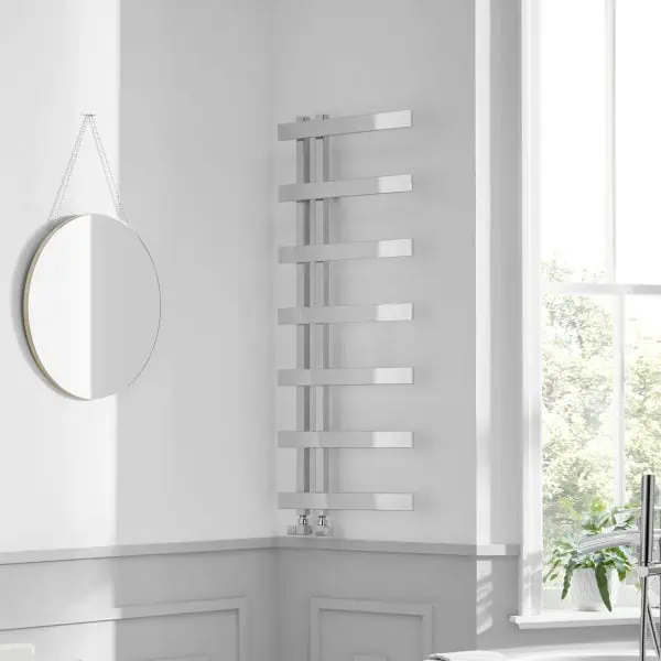 Radiator towel warmer in modern bathroom, sleek stainless steel finish, wall-mounted heating solution.