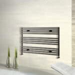 Modern black heated towel rail for bathroom heating and drying towels.