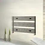Modern black heated towel rail for bathroom heating and drying towels.