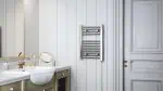 Shower towel radiator heater on a white wooden wall in modern bathroom setting.