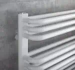 Modern white towel radiator for bathroom heating and drying.