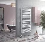 Modern white towel radiator in contemporary bathroom with bathtub and stylish decor.