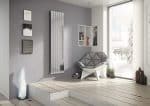 Modern living room interior with sleek wall radiator, cozy chair, and minimalist decor.