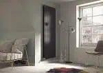 Modern radiator heating system in stylish bedroom decor.