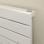 Radiator with modern white finish and adjustable thermostat control, ideal for home heating solutions.