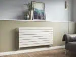 Modern white radiator in a stylish living room featuring minimalist decor and a wooden floor.
