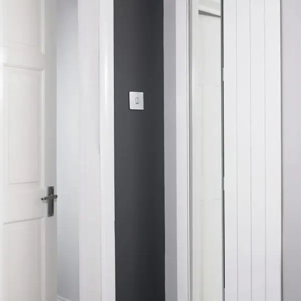 Bright white modern radiators and crisp door trim in a stylish interior space.