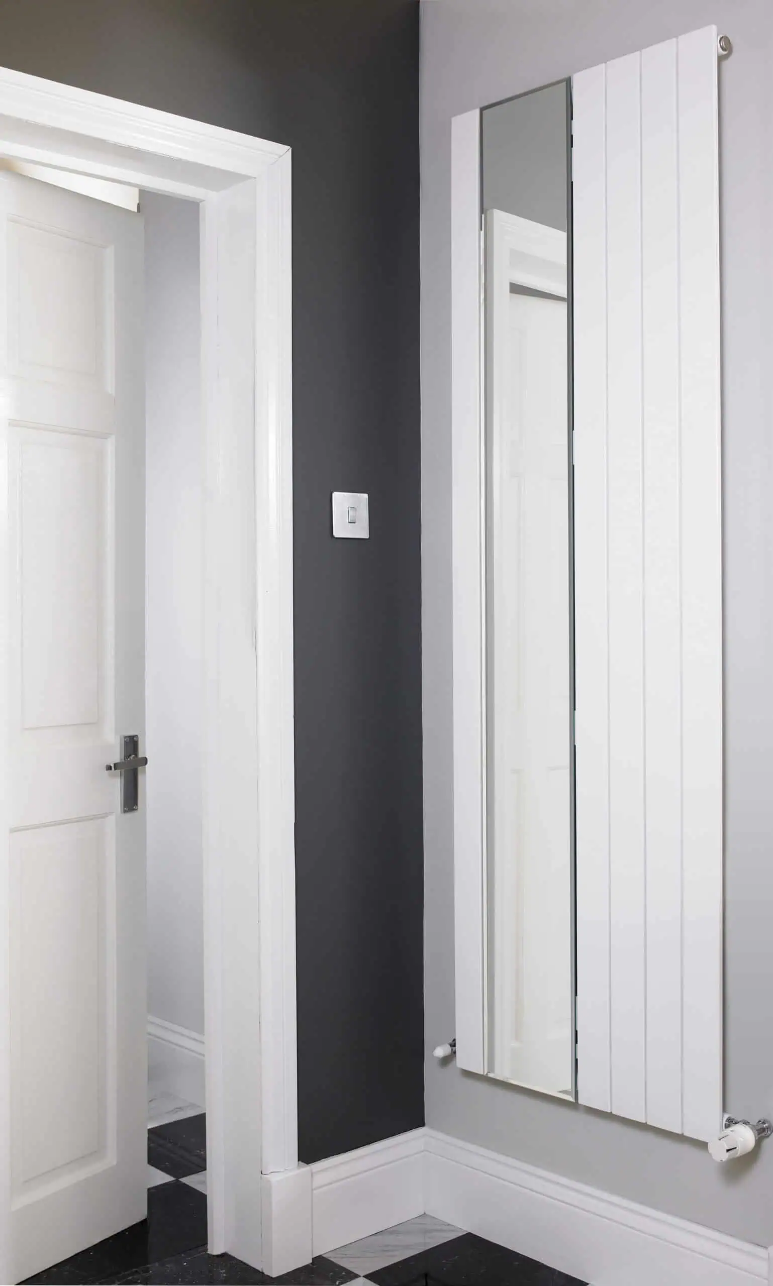 Mars-Mirror-White-scaled-2.jpg Bright white modern radiators and crisp door trim in a stylish interior space.