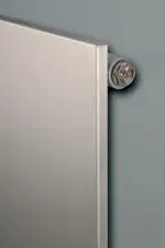 Radiator close-up image, modern stainless steel heating radiator for homes or offices.
