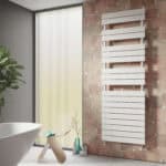 Contemporary white towel radiator in modern bathroom with natural decor and textured wall tiles.