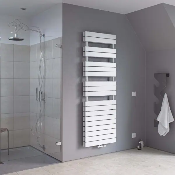 Modern bathroom with gray walls and unique radiator design.