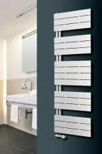 Modern white radiator installed in a contemporary bathroom for efficient heating and stylish decor.