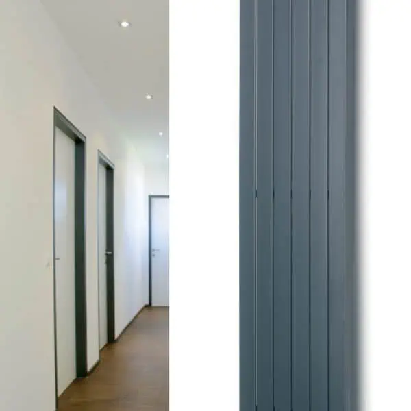Modern vertical radiator heating unit for home or office decor.
